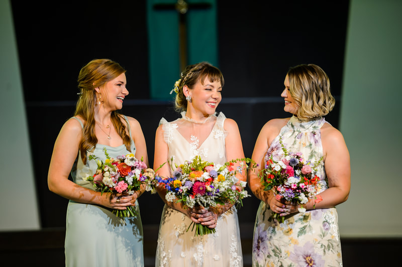 Bride and her wedding party holding beautiful bouquets